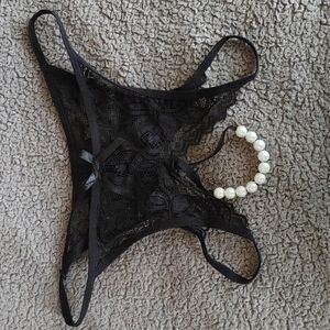 Black sexy crotchless panties with pearl thong detail. Size L, NWOT